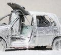 damaged car full of foaming agent used by firefighters to put ou