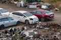 Damaged cars on the junkyard, discarded old cars