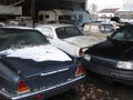 Damaged cars are standing in the garage