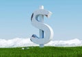 Damaged concrete dollar sign statue isolated on grass meadow with snowy mountain and blue sky as background