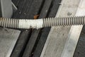 Damaged corrugated hose repaired with adhesive tape