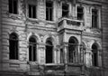 Damaged, destroyed building as a result of the war between Russia and Ukraine. Black and white photography