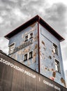 Damaged facade of old building of train station in city Ruzomberok at Slovakia