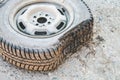 Damaged flat tire of an old car on the road with selective focus. Royalty Free Stock Photo