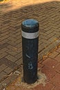 Damaged guard pole with a white band