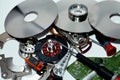 Damaged Hard disk drive components with disks, read write head, spindle motor, suspension, pivot, voice coil motor VCM, E-block,
