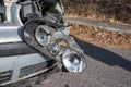 Damaged headlight on Volkswagen Golf after side collision.