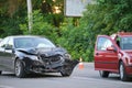 Damaged in heavy car accident vehicles after collision on city street crash site. Road safety and insurance concept Royalty Free Stock Photo