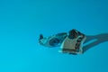 Damaged and marked twenty dollar bill on a blue background