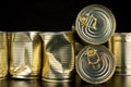 Damaged metal can with vegetables on a wooden table. Canned vegetables in a can Royalty Free Stock Photo