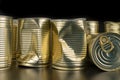 Damaged metal can with vegetables on a wooden table. Canned vegetables in a can Royalty Free Stock Photo