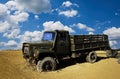 A damaged military truck on the battlefield. military technics.