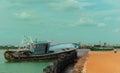 Abandoned fisherman boat on a indian small harbor.