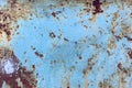 Damaged old peeling paint blue background rusty metal flat pallet. Cracked oil paint on aged metal surface. Close-up Royalty Free Stock Photo