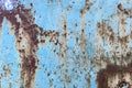 Damaged old peeling paint blue background rusty metal flat pallet. Cracked oil paint on aged metal surface. Close-up Royalty Free Stock Photo