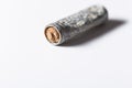 Damaged and old rusty battery close up still on a white background Royalty Free Stock Photo