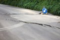 Damaged road with big cracks Royalty Free Stock Photo