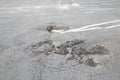Damaged road. Deep crack on the asphalt