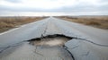 Damaged road with large pothole. Roadway surface shows extensive cracking, deep depression. Pothole serious road defect. Empty Royalty Free Stock Photo