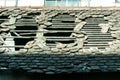 Damaged roof on old house with vintage tiles and hole. Royalty Free Stock Photo