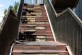 Damaged staircase. Old staircase in the metropolis. Broken stairs on a flight of stairs