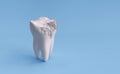 Damaged tooth isolated on blue background with clipping path.