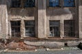 Damaged wall of an old building with windows Royalty Free Stock Photo