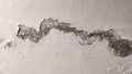 damaged wall surface showing flaking and erosion Royalty Free Stock Photo