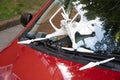 Damaged white drone on broken car windshield Royalty Free Stock Photo