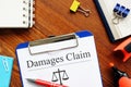 Damages claim is shown using the text Royalty Free Stock Photo