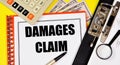 Damages claim. Text label in the working document. Royalty Free Stock Photo
