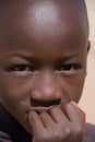 Damaraland, Namibia - August 2016: Face of a Himba Boy