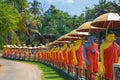 row of Buddhist monk statues in Dambulla Royalty Free Stock Photo