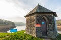 DAMFLASK, ENGLAND - FEBRUARY 23RD, 2019: A lone Yorkshire Water building sits at the front of the Damflask Reservoir