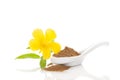 Damiana herb powder in spoon.