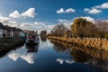 Damme, West Flemish Region, Belgium - The canal of the Damse vaart with a boat reflectig in the water