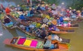 Damnoen Saduak Floating Market or Amphawa. Local people sell fruits, traditional food on boats in canal, Ratchaburi District, Royalty Free Stock Photo