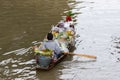 Damnoen Saduak Floating Market, Thailand small boats laden with colourful fruits and vegetables and paddled by Thai women