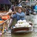 Woman selling Coconuts in Damnoen Saduak Royalty Free Stock Photo