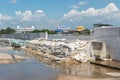 Dams from sand bags prevent flooding from river