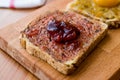 Damson Plum Jam on bread with Apricot jam. Royalty Free Stock Photo