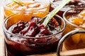 Damson Plum Jam with spoon in glass bowl and various marmalades Royalty Free Stock Photo