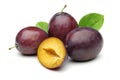 Damson plums with leaf isolated on white Royalty Free Stock Photo