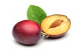 Damson plums with leaves on white background Royalty Free Stock Photo