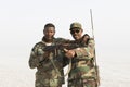 Danakil, Ethiopia, January 22 2015: Two soldiers posing proudly with their guns in the Danakil desert