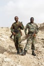 Danakil, Ethiopia, January 1 2015: Two soldiers posing proudly with their guns in the salt mountains