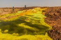 DANAKIL, ETHIOPIA - MARCH 24, 2019: Tourists take photos of colorful sulfuric lakes of Dallol volcanic area, Danakil