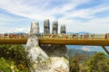 Danang, Vietnam - JUNE, 24, 2019: The Golden Bridge in the Bana Valley, supported by a giant hand This bridge is 1,400 meters