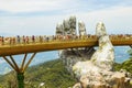 Danang, Vietnam - JUNE, 24, 2019: The Golden Bridge in the Bana Valley, supported by a giant hand This bridge is 1,400 meters