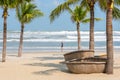 Danang Beach with coracles and a traveler Royalty Free Stock Photo